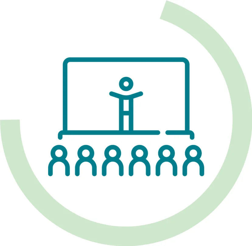 Icon symbolizing a workshop or conference: Green standing person in front of six seated people, surrounded by a light green semicircular arc