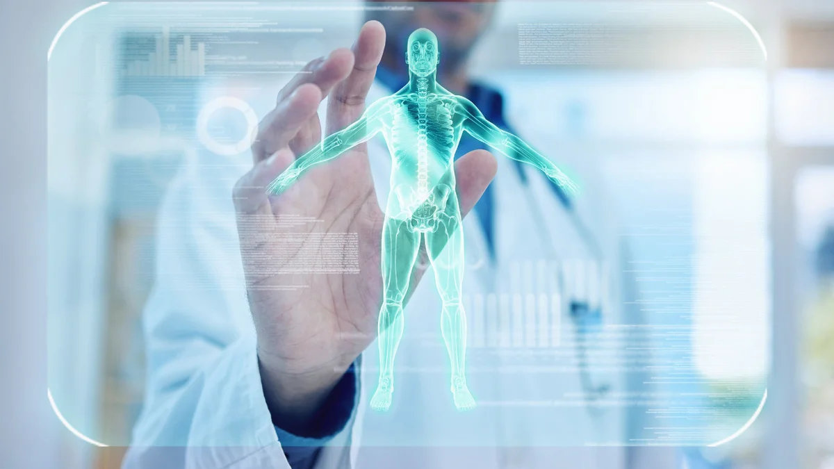 Unfocused digital image of a person reaching toward a screen displaying a body scan.